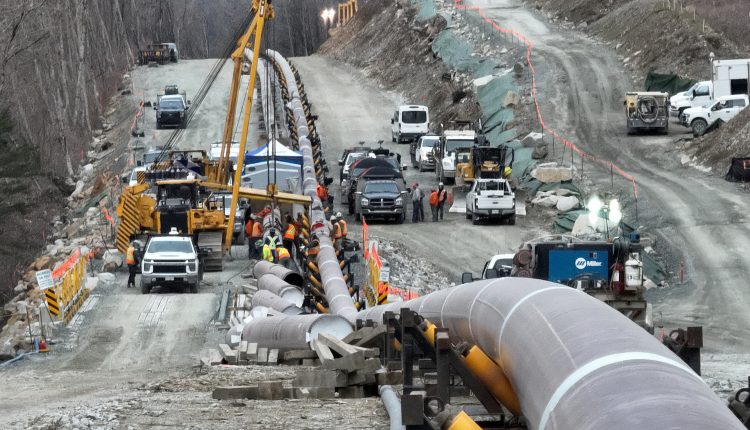 The last section of pipeline is assembled on the Trans Mountain ...